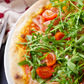 Mezza luna (Paradicsomszósz, mozzarella, ricotta, sonka, koktél paradicsom, rucola)