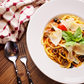 Spagetti puttanesca (paradicsomszósz, hagyma, chili, fekete olíva)